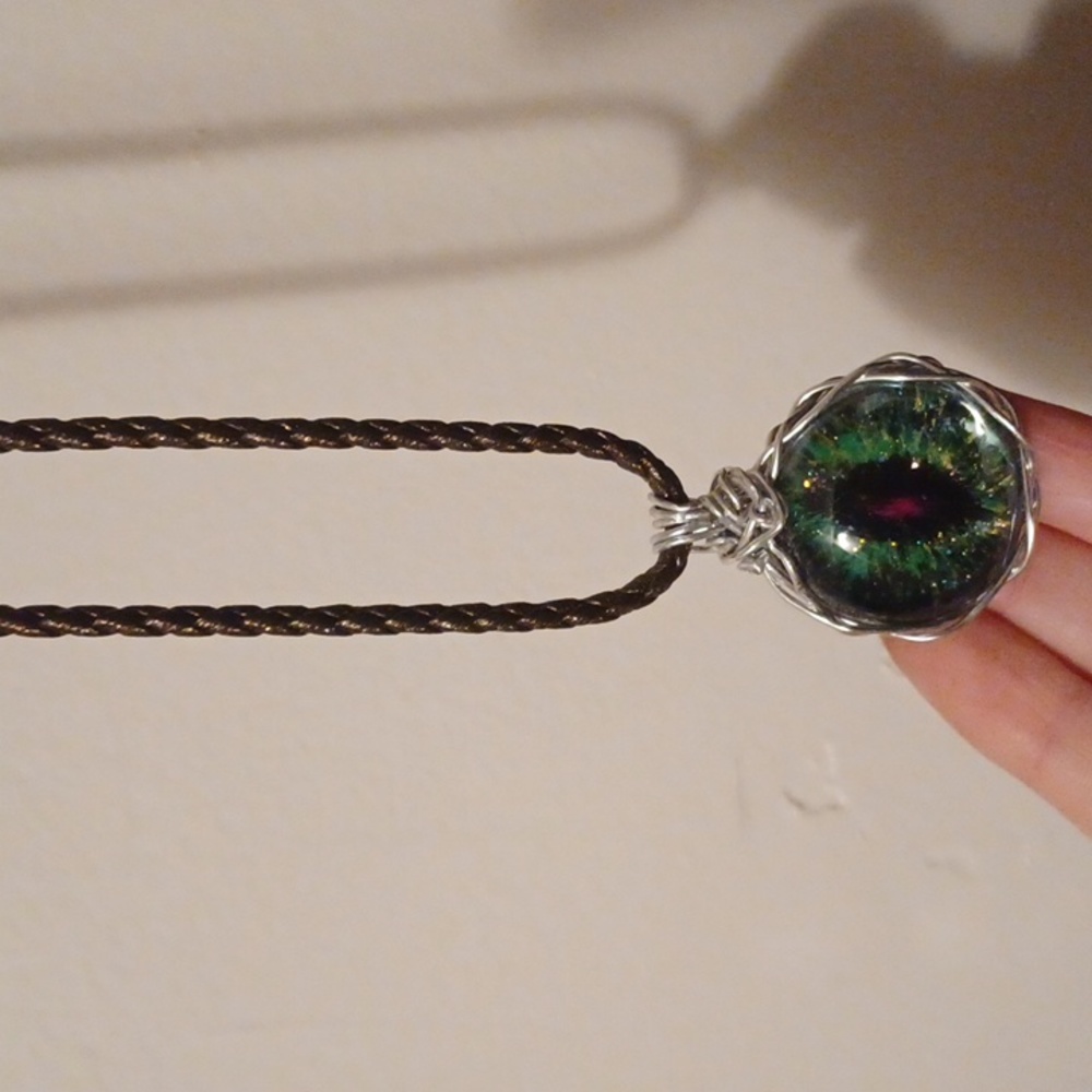 Green and pink dragon(?) eye necklace